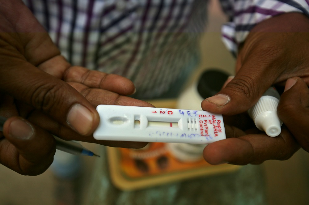 A health worker shows a malaria rapid test kit after collecting blood sample from a resident during a drive to prevent the spread of mosquito-borne diseases in Ahmedabad, India October 26, 2018. u00e2u20acu201d Reuters pic   
