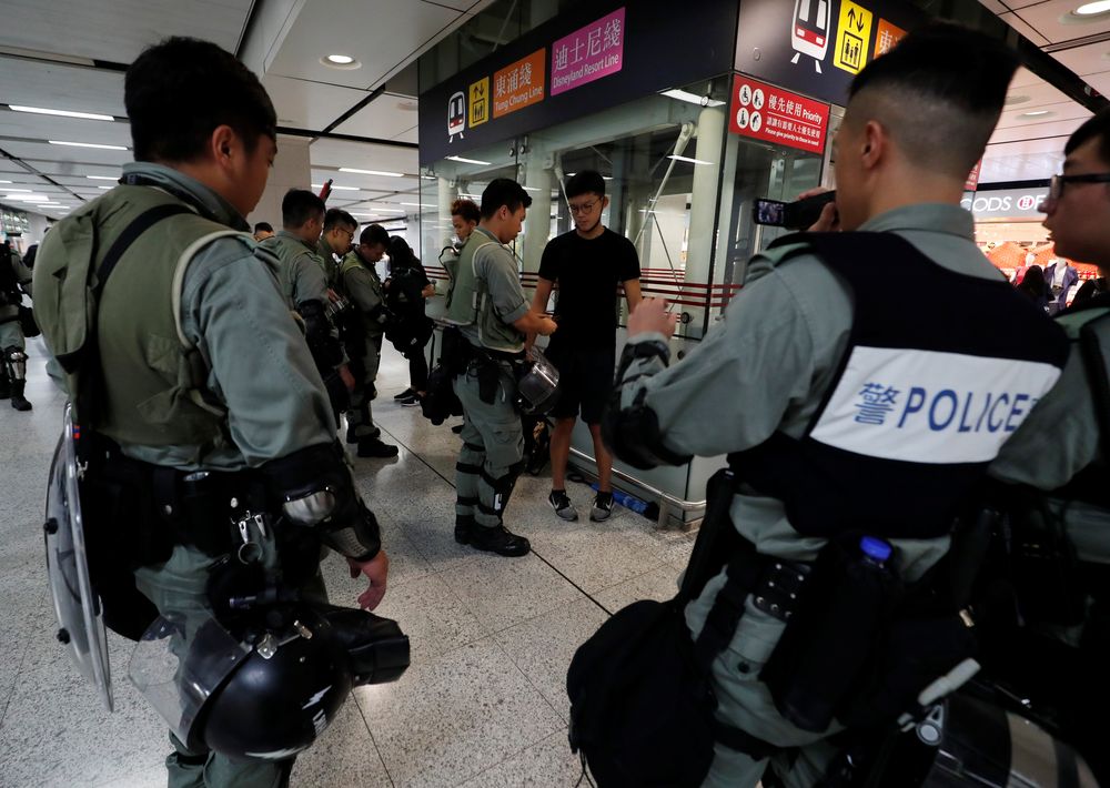 Police search for identification while patrolling at a MTR station as they keep a lookout for protesters in Hong Kong, China, September 7, 2019. u00e2u20acu201d Reuters pic