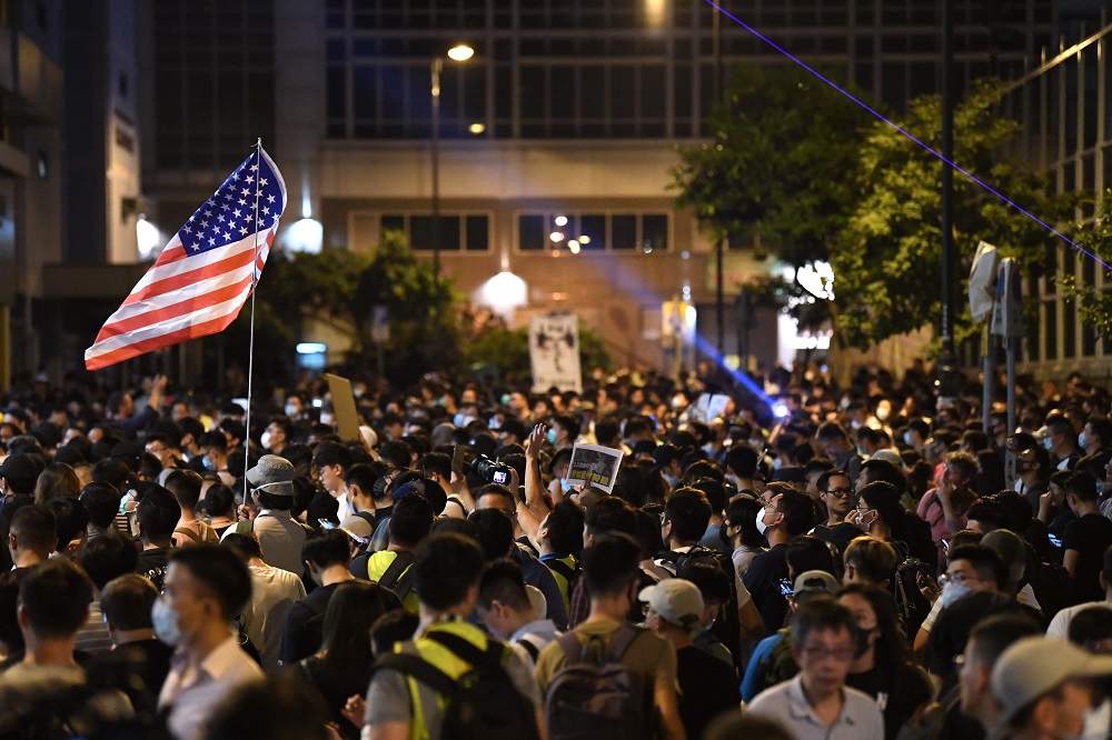 People gather outside the Queen Elizabeth Stadium in the Wanchai district of Hong Kong on September 26, 2019, where Hong Kongu00e2u20acu2122s chief executive Carrie Lam is meeting some 150 people picked via lottery to attend the town hall event. u00e2u20acu201d AFP pic  