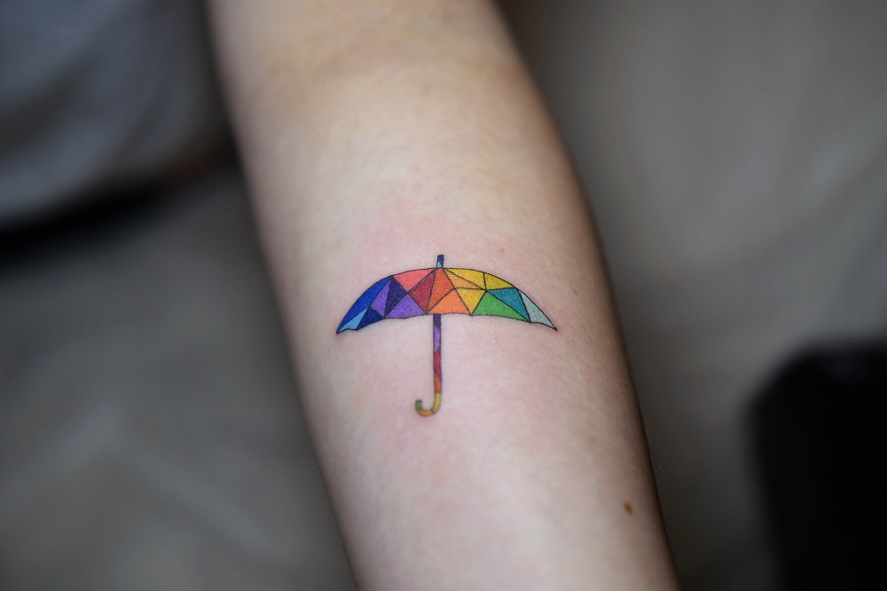 This photo taken on August 22, 2019 shows tattoo artist Zada Lam working on an umbrella tattoo at his studio in Hong Kong. u00e2u20acu201d AFP pic         