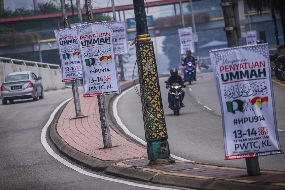 Banners for the Muslim Unity Rally  line the road leading to Putra World Trade Centre in Kuala Lumpur September 12, 2019. u00e2u20acu201d Picture by Hari Anggara