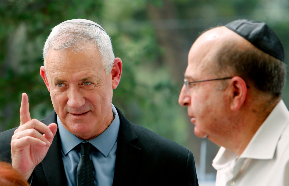 Israelu00e2u20acu2122s Blue and White political alliance membersu00e2u20acu2122 Moshe Yaalon (right) and Benny Gantz attend a memorial ceremony for late Israeli president Shimon Peres, at Mount Herzl in Jerusalem September 19, 2019. u00e2u20acu201d AFP pic 