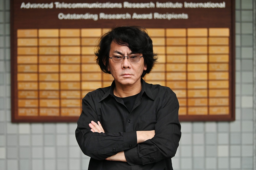 This photo taken on June 16, 2019 shows robotician Hiroshi Ishiguro posing at his research centre in Osaka. — AFP pic
