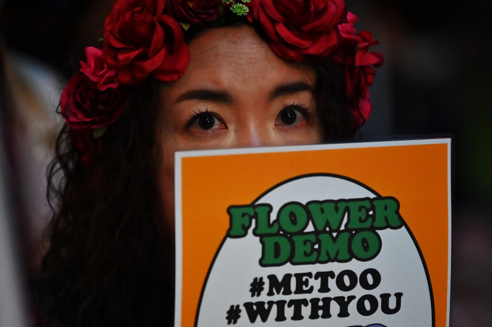 This file photo taken on June 11, 2019 shows a demonstrator holding a placard during a protest against the lack of substantial legal protection for sexual assault victims in Tokyo. u00e2u20acu2022 AFP pic              