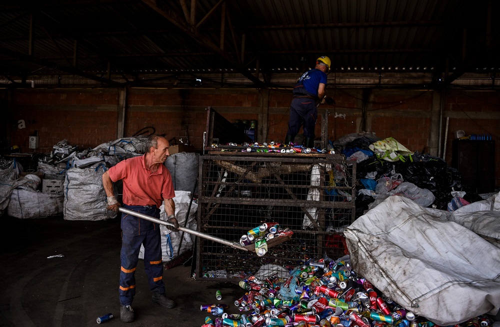 Employees arrange recycled items at a scrap yard near the town of Fushe. Kosovo September 10, 2019. u00e2u20acu201d AFP pic  