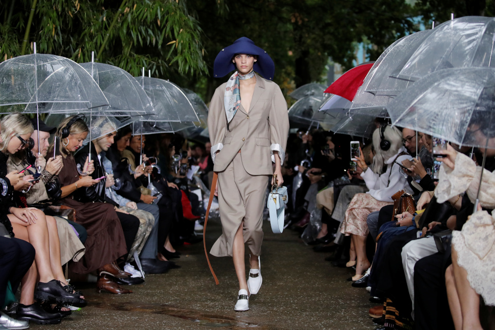 A model presents a creation by designer Bruno Sialelli in the garden atmosphere setting of the show. — Reuters pic
