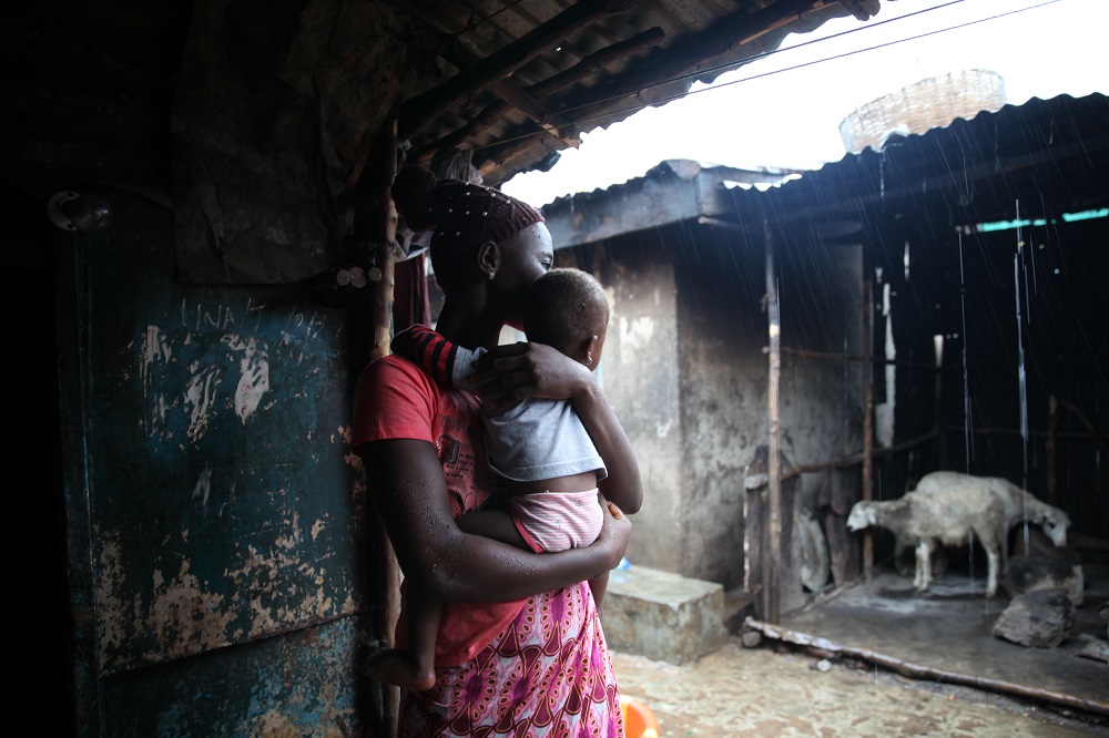 Adja, 17, poses for a portrait with her baby in Susanu00e2u20acu2122s Bay, Freetown, Sierra Leone July 24, 2019. u00e2u20acu201d Thomson Reuters Foundation pic