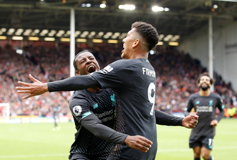 Liverpoolu00e2u20acu2122s Georginio Wijnaldum celebrates scoring their first goal with Roberto Firmino against Sheffield United at Bramall Lane in Sheffield, September 28, 2019. u00e2u20acu201d Reuters pic