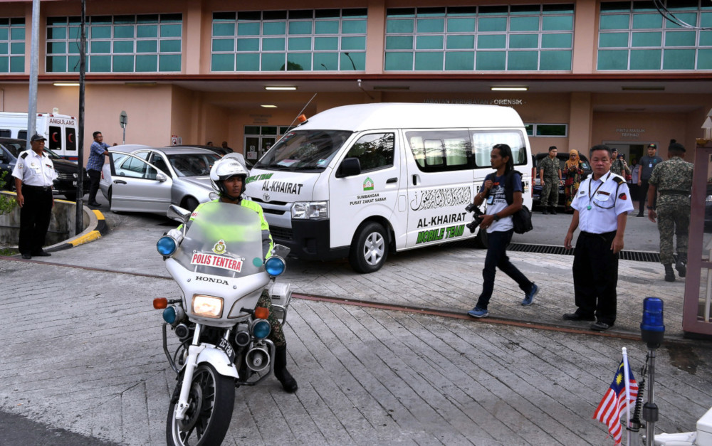 A van carrying the remains of Major Mohd Zahir Armaya from the Forensic Pathology Unit at Queen Elizabeth Hospital in Kota Kinabalu September 4, 2019. u00e2u20acu201d Bernama pic 