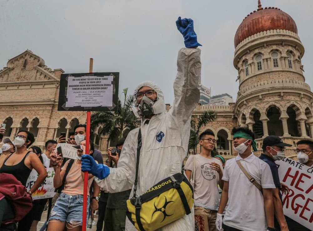 Protesters march and hold placards as they attend the Global Climate Strike in Kuala Lumpur, September 21, 2019. u00e2u20acu201d Picture by Firdaus Latif