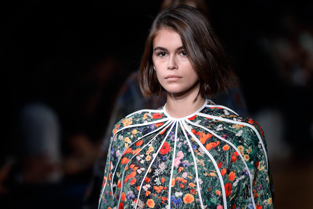US model Kaia Gerber wearing one of a series of ingenious flower print dresses at the Opera Garnier in Paris, September 30, 2019. — AFP pic