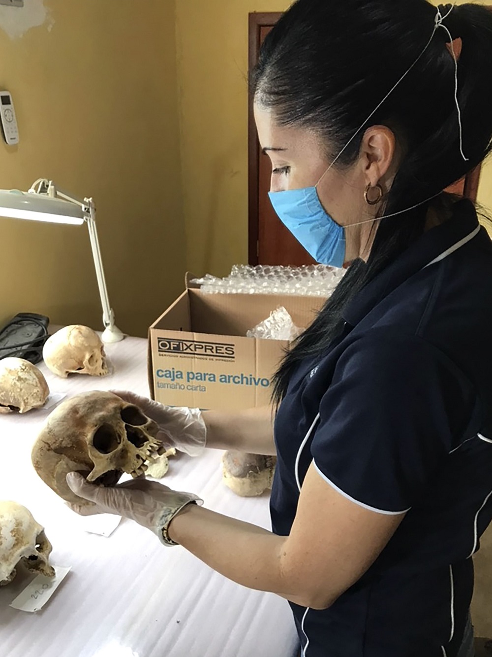 This undated handout picture taken in 2019 and received on September 13, 2019 by the CQ University Australia shows researcher Alyson Wilson working on ancient Mayan skeletal remains at an undisclosed location in Mexico. u00e2u20acu201d CQ University Australia/AFP pic