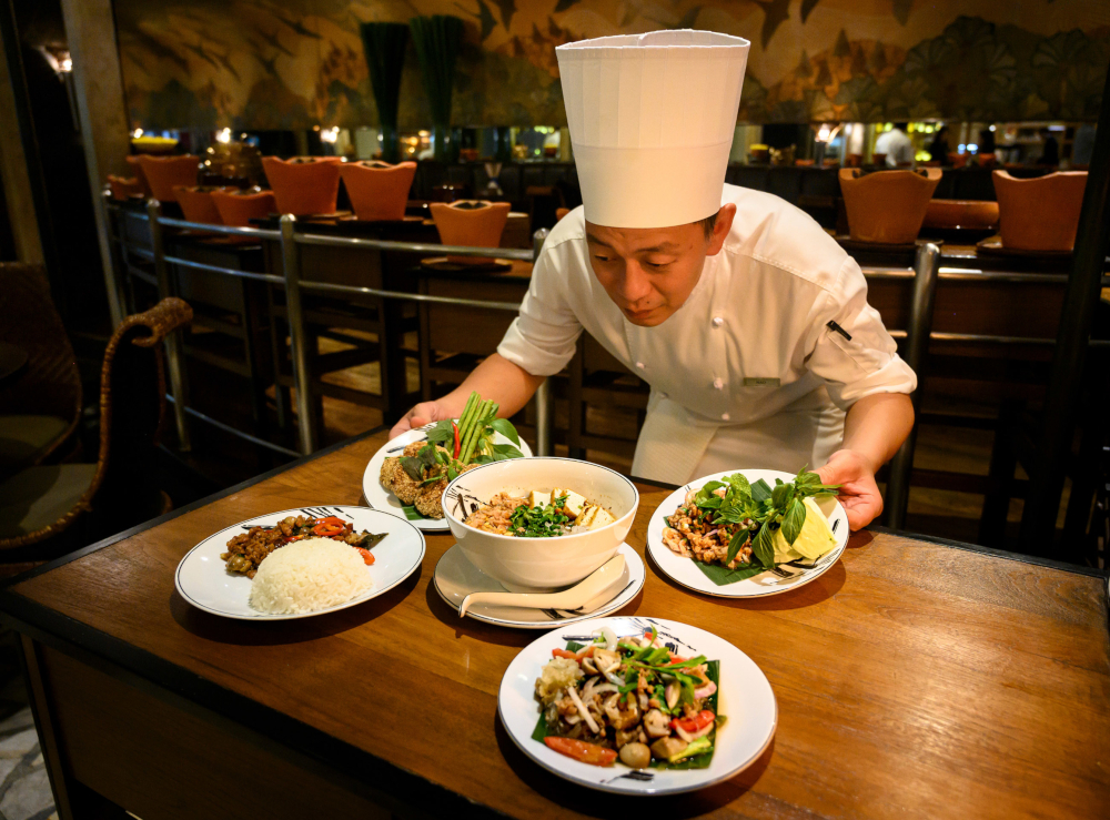A chef presenting vegetarian versions of various Thai dishes prepared with a meat substitute at a restaurant in Bangkok. u00e2u20acu201d AFP pic