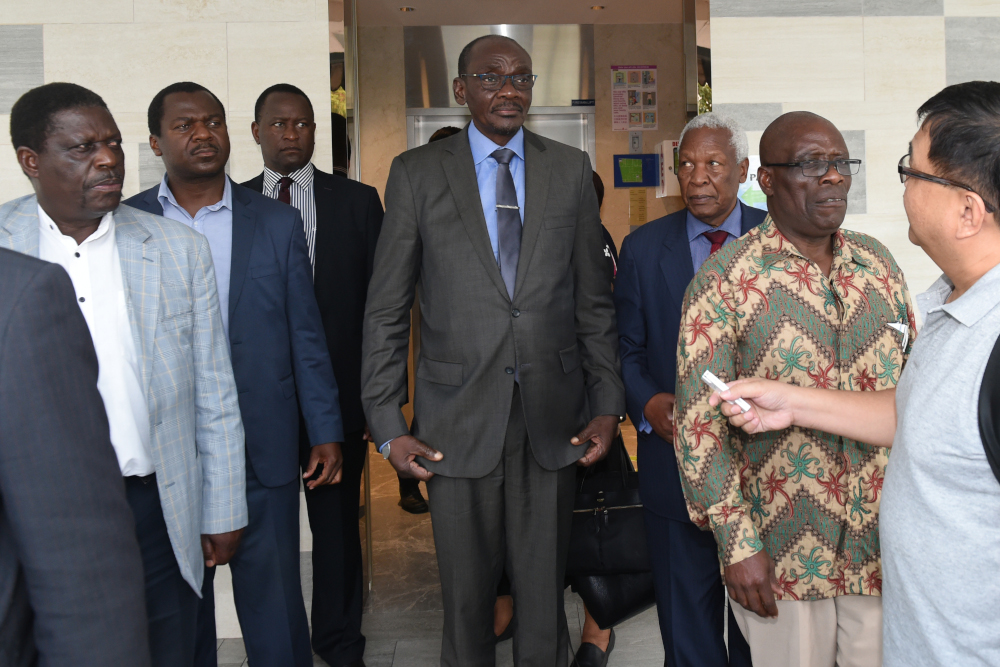 Zimbabweu00e2u20acu2122s Vice President Kembo Mohadi (centre) leaves the Singapore Casket building in Singapore September 10, 2019, where the body of former Zimbabwe president Robert Mugabe is currently being kept. u00e2u20acu201d AFP pic