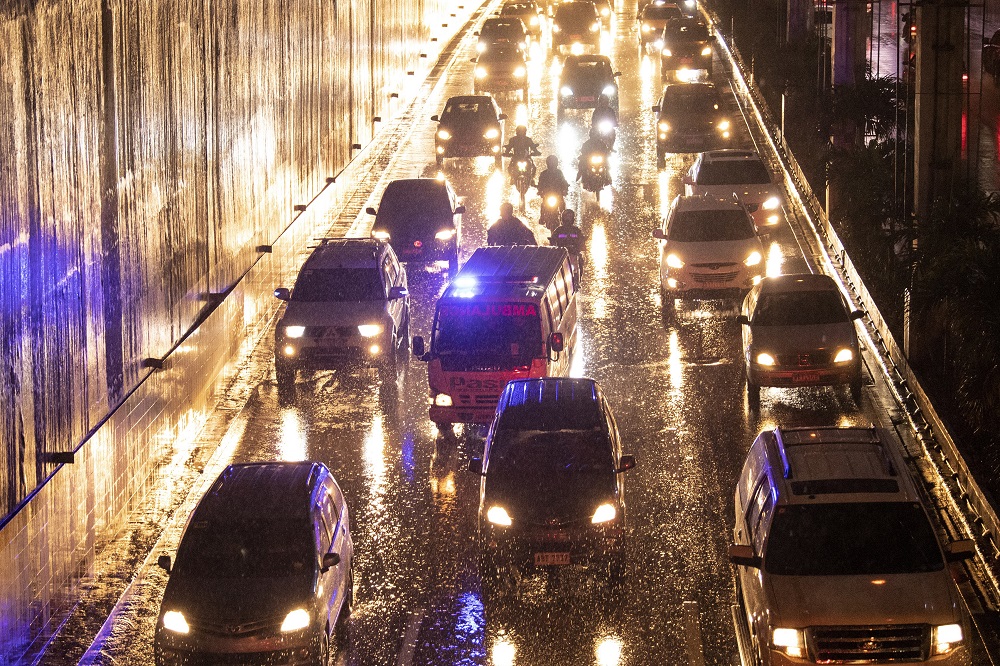 This photo taken on August 5, 2019 shows an ambulance negotiating through rush hour traffic along the EDSA highway in Manila. u00e2u20acu201d AFP pic       