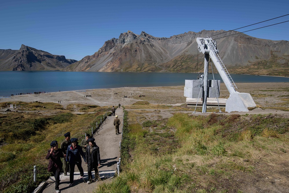 A photo taken on September 11, 2019 shows visitors walking towards a cable car station before Chonji lake, or u00e2u20acu02dcHeaven lakeu00e2u20acu2122 in the crater of Mount Paektu, near Samjiyon. u00e2u20acu201d AFP pic  