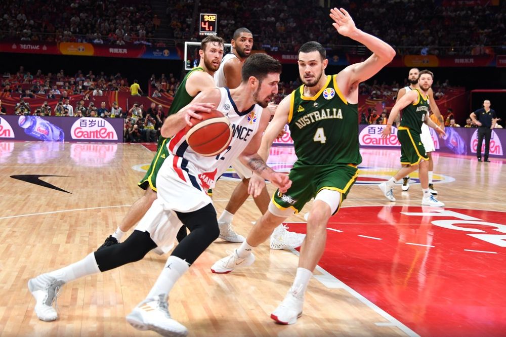 Franceu00e2u20acu2122s Nando De Colo (left) dribbles the ball next to Australiau00e2u20acu2122s Chris Goulding during the Basketball World Cup third place game between France and Australia in Beijing on September 15, 2019. u00e2u20acu201d AFP pic