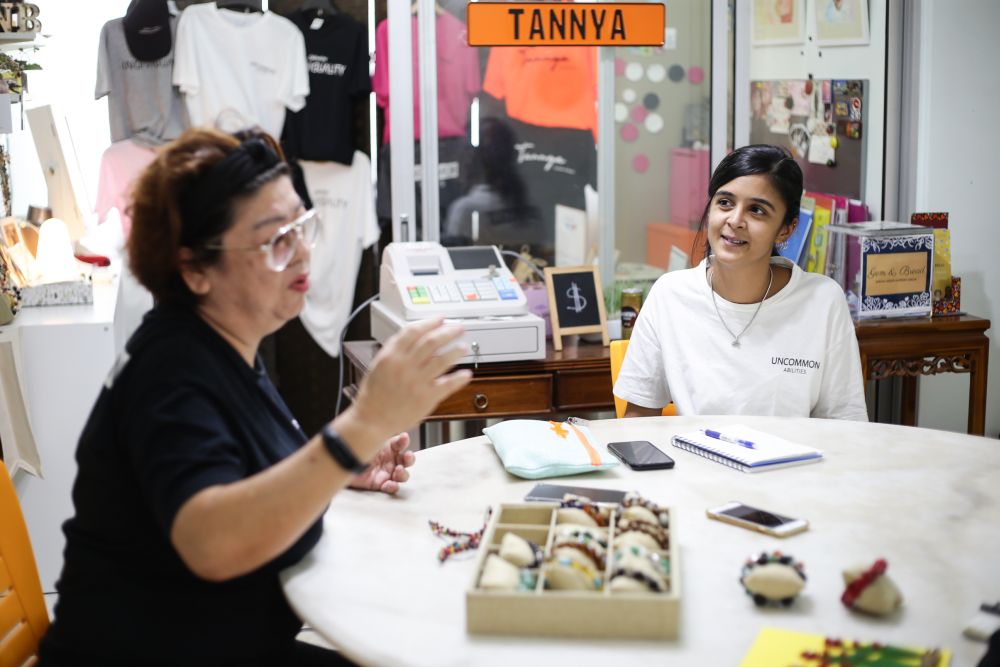 Sharanya (right) said that due to the low awareness of Malaysians about special needs youths, many are often bullied when they enter the workforce. — Picture by Ahmad Zamzahuri