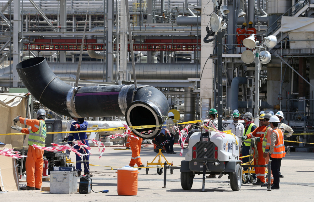 Workers fix a pipeline at the damaged site of Saudi Aramco oil facility in Khurais, Saudi Arabia, September 20, 2019. u00e2u20acu201d Reuters pic 
