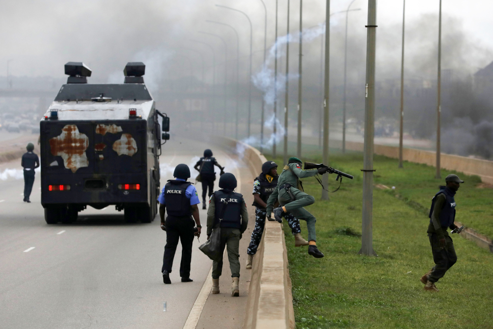 Anti-riot policemen try to chase protesters during a demonstration and attacks against South Africau00e2u20acu2122s owned shops in Abuja, September 4, 2019. u00e2u20acu201d AFP pic