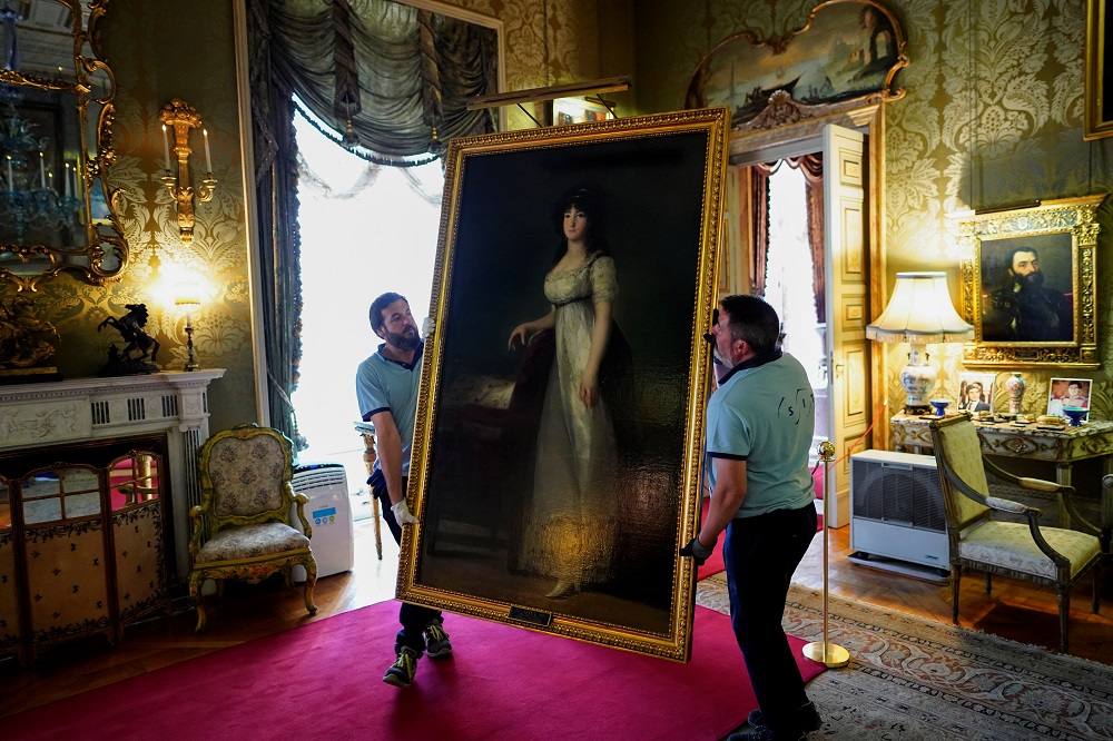 Workers carry ‘The Marquise of Lazan’ painting by the Spanish painter Francisco Goya at Palace of Liria in Madrid, Spain September 9, 2019. — Reuters pic