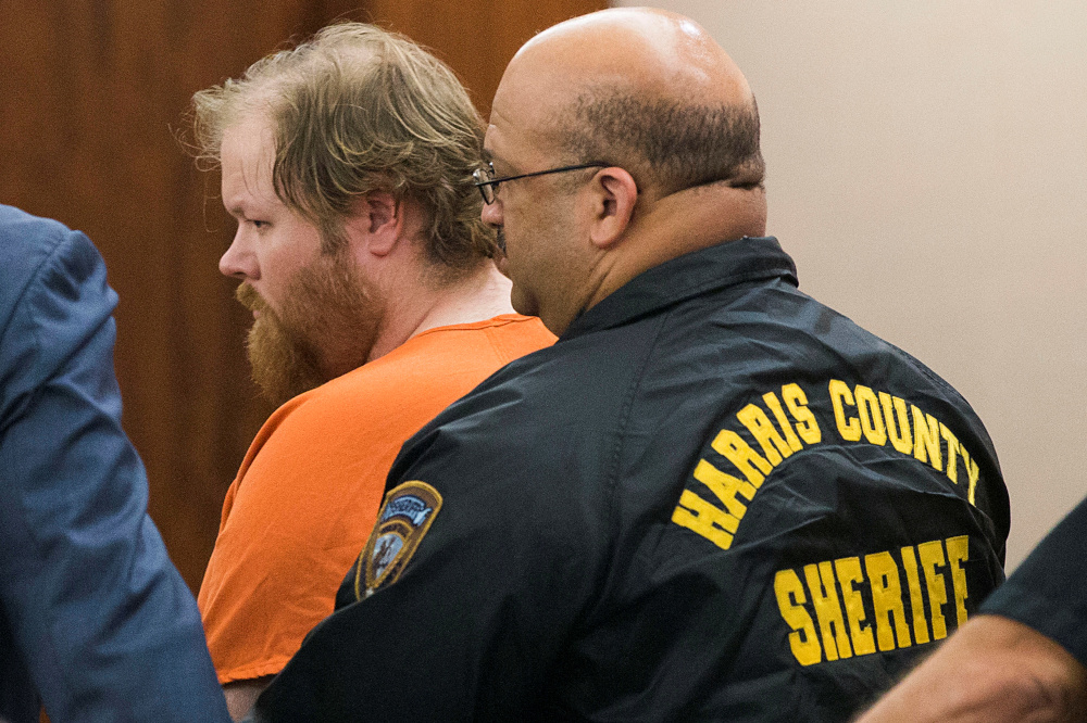 Accused mass shooter Ronald Lee Haskell is escorted by deputies for a hearing in Houston, Texas July 11, 2014. u00e2u20acu201d Reuters pic