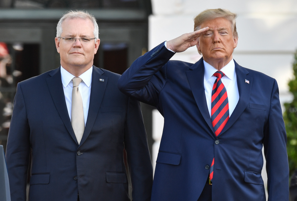 US President Donald Trump stands at attention with Australian Prime Minister Scott Morrison during an Official Visit by the Australian PM at the White House in Washington, DC September 20, 2019. u00e2u20acu201d AFP picnn