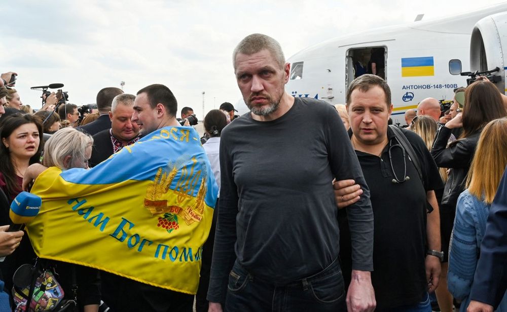 A former prisoner is helped by a medical worker after he disembarked from a plane on September 7, 2019 at Boryspil international airport in Kiev after a long-awaited exchange of prisoners between Moscow and Kiev. u00e2u20acu201d AFP pic