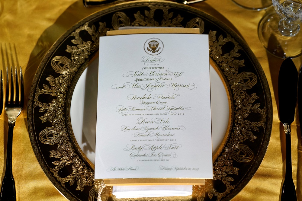 A menu is seen on the table with floral arrangements and place settings for the Trump administrationu00e2u20acu2122s state dinner with Australia in the Rose Garden of the White House in Washington September 19, 2019. u00e2u20acu201d Reuters pic