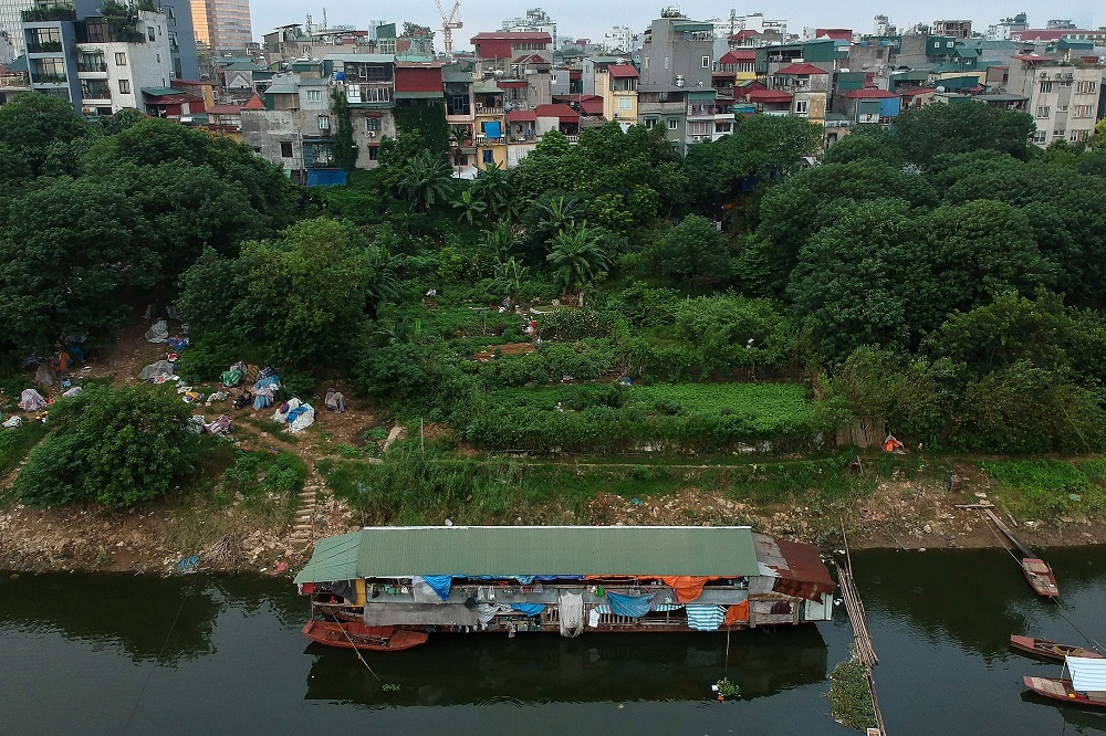 This aerial photograph taken on September 8, 2019 shows a floating guesthouse for migrant workers on the banks of the Red River in Hanoi. — AFP pic       