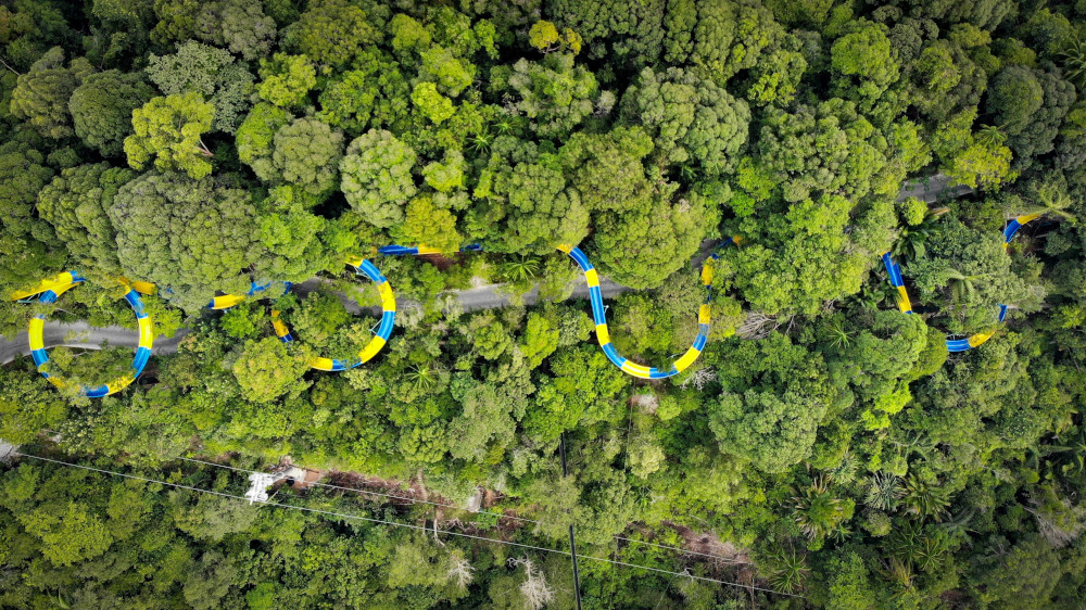 This aerial handout picture taken by Sim Leisure Group Ltd September 11, 2019 and released September 25, 2019 shows the world’s longest water slide at Escape theme park in Teluk Bahang, Malaysia. — Sim Leisure Group Ltd handout pic via AFP