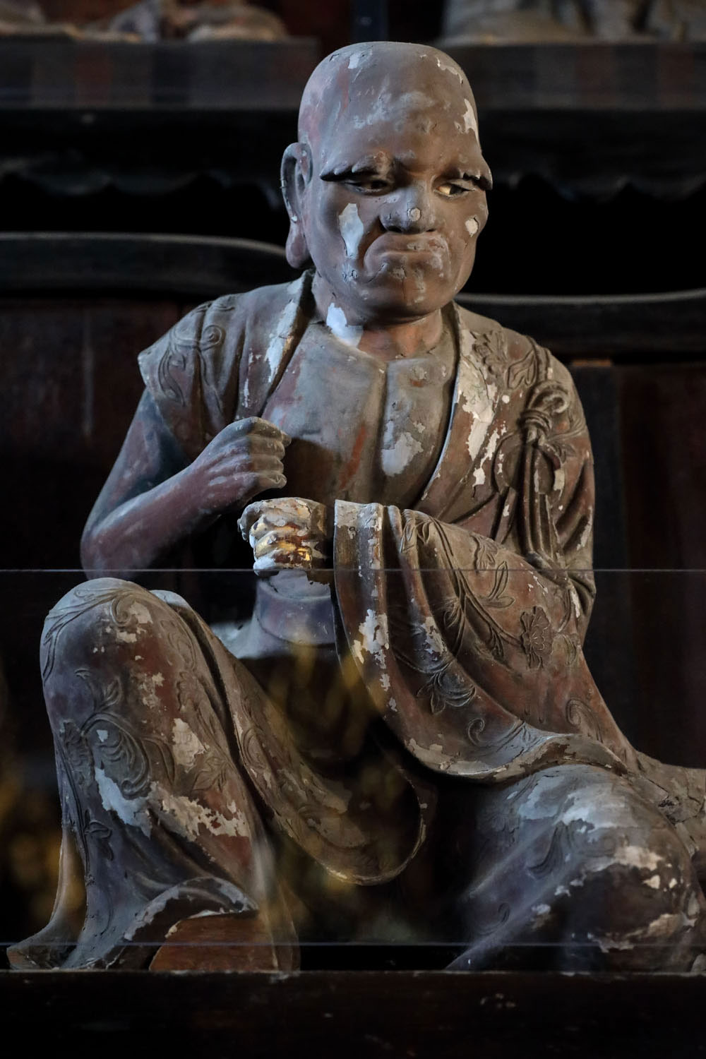 Close-up of one of the Arhat statue, carved entirely from wood.