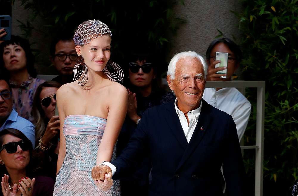 Italian designer Giorgio Armani poses with a model after the catwalk of Giorgio Armani Spring/Summer 2020 collection during fashion week in Milan, Italy September 21, 2019. u00e2u20acu201d Reuters pic