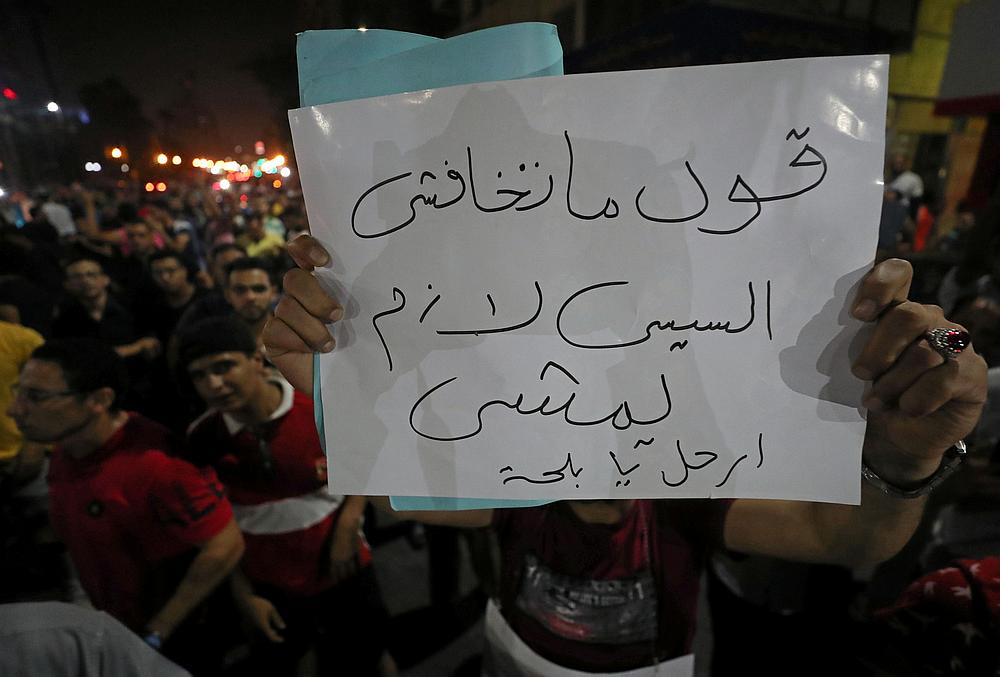 A protester carries a sign that reads 'Don't be afraid ..say .. Sisi must leave' while protesters gather in central Cairo shouting anti-government slogans September 21, 2019. u00e2u20acu201d Reuters pic