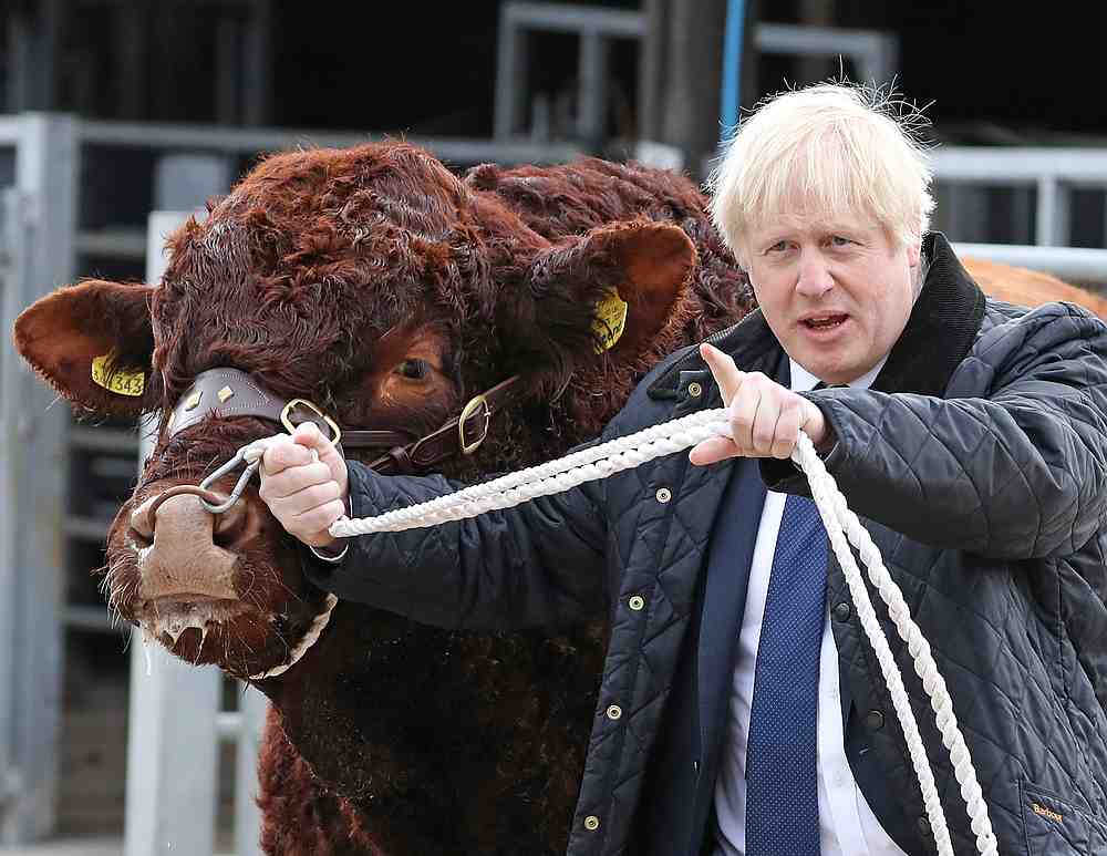 Britain's Prime Minister Boris Johnson visits Darnford Farm in Darnford, Banchory near Aberdeen, Scotland, September 6, 2019. u00e2u20acu201d Andrew Milligan/Pool pic via Reuters