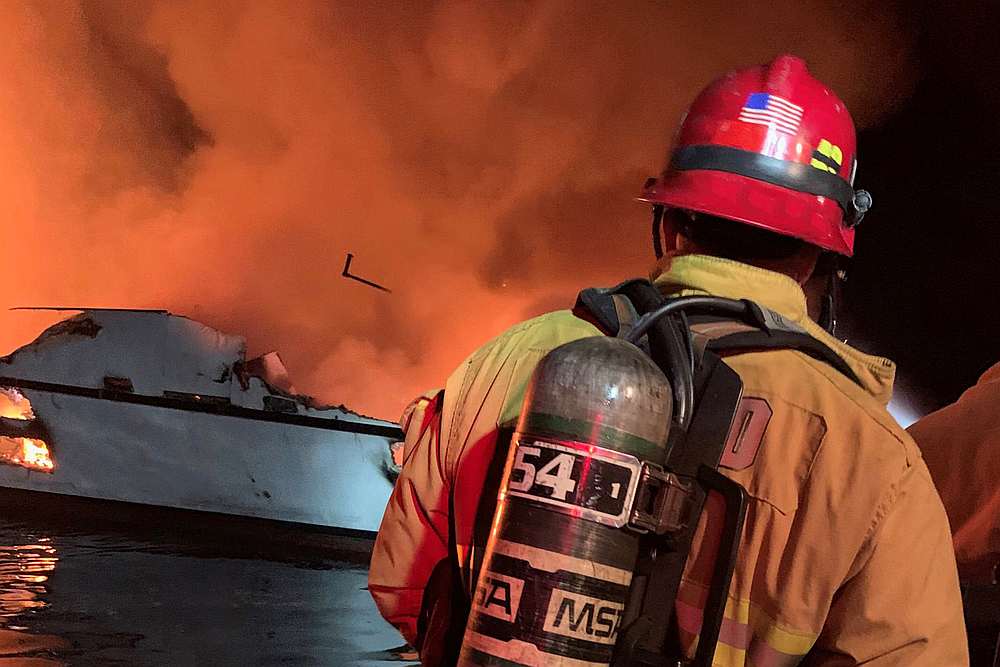Firefighters respond to a boat fire on a 23m vessel off Santa Cruz Island, California September 2, 2019. u00e2u20acu201d Ventura County Fire Department handout via Reuters