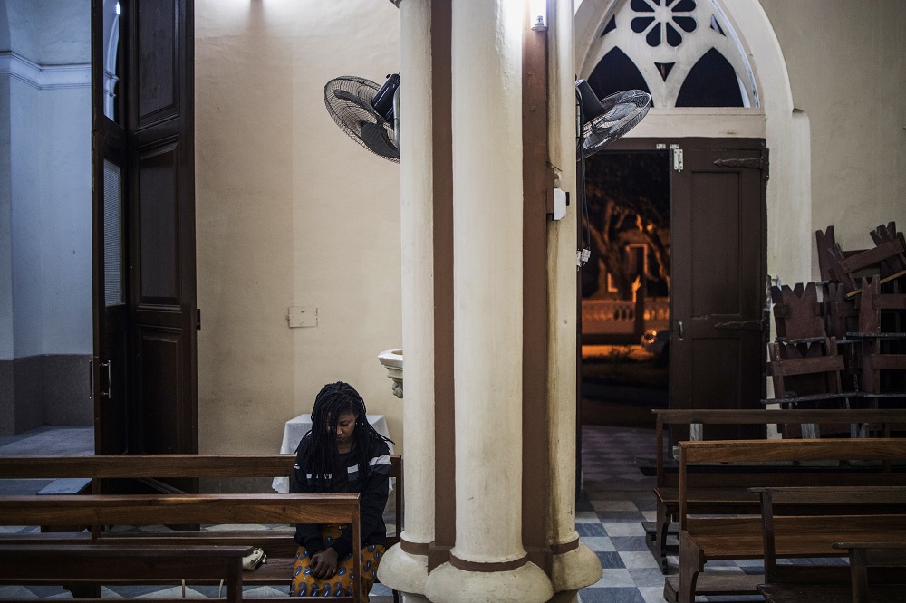 A Catholic faithful prays at the Our Lady of the Rosary Cathedral in Beira, central Mozambique August 20, 2019. u00e2u20acu201d AFP pic         