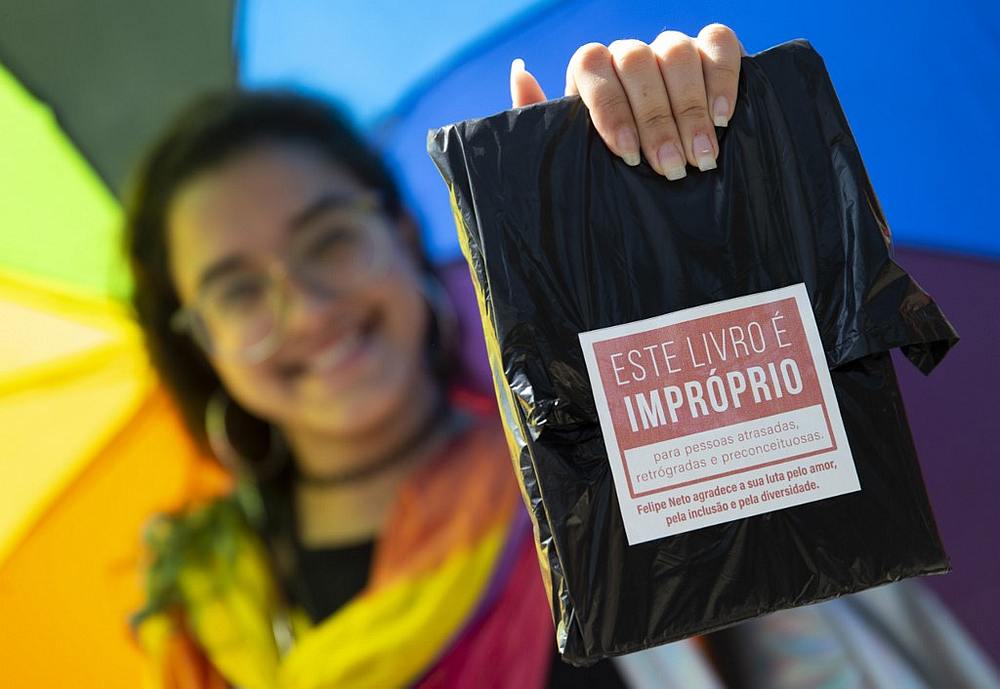 A woman holding a book of LGBT themes at the Rio Book Fair in Rio de Janeiro, Brazil September 08, 2019. u00e2u20acu201d Rio Biennial Book Fair handout via AFP