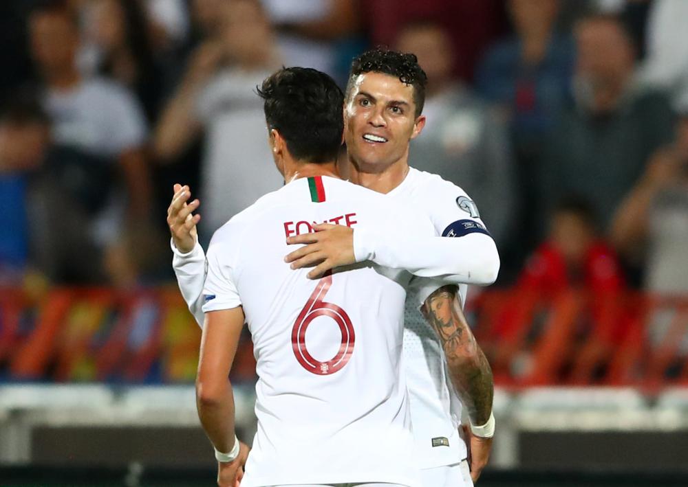 Portugal's Cristiano Ronaldo celebrates with Jose Fonte after scoring the third goal against Serbia September 7, 2019. u00e2u20acu2022 Reuters pic