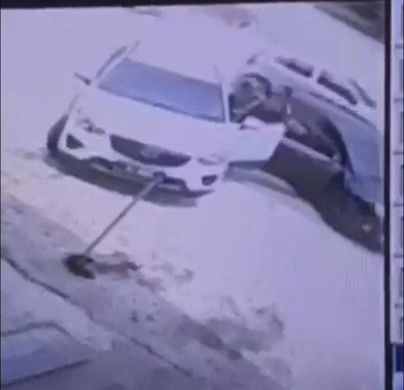 A man who is allegedly a doctor was filmed beating up a woman and an older man after blocking their car. u00e2u20acu2022 Screenshot via social media