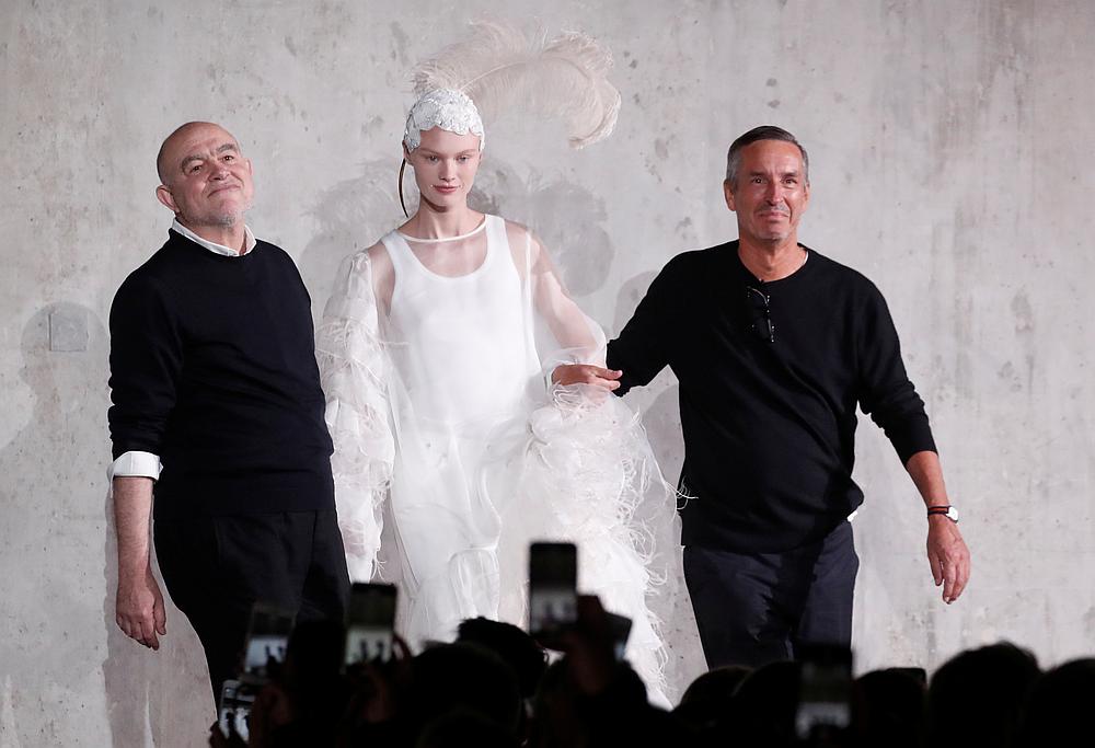 Designer Dries Van Noten appears with designer Christian Lacroix and a model at the end of his Spring/Summer 2020 women's ready-to-wear collection show during the Paris Fashion Week September 25, 2019. u00e2u20acu201d Reuters pic