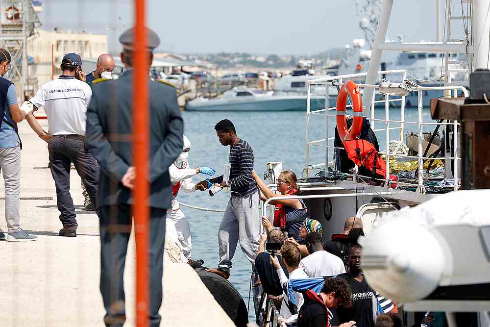 A migrant gets out of the rescue ship Eleonore after it docked in Pozzallo, Italy September 2, 2019. u00e2u20acu201d Reuters pic 