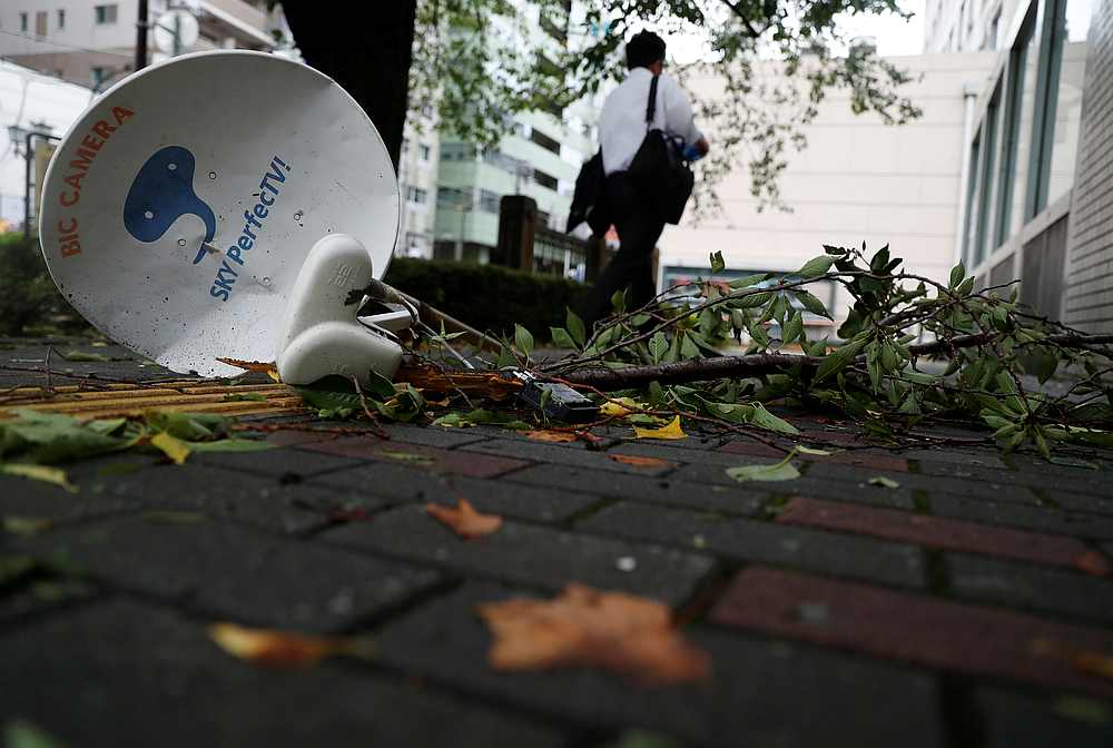 A satellite broadcast television receiving antenna, which was blown away by strong winds caused by Typhoon Faxai, is seen on a street in Tokyo, Japan September 9, 2019. u00e2u20acu201d Reuters pic