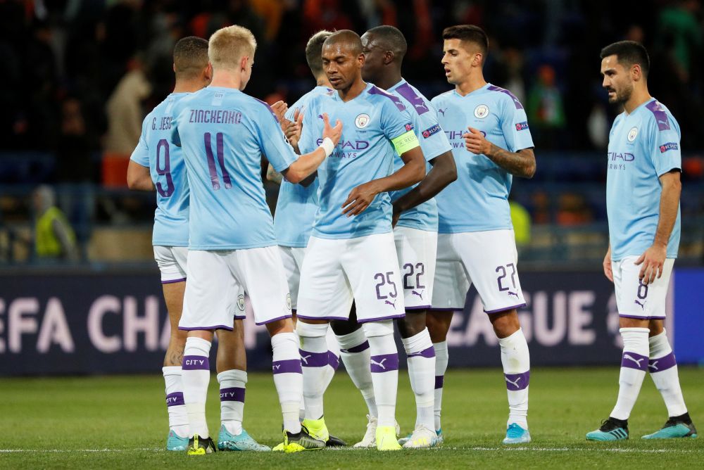 Manchester City's Fernandinho shakes hands with Oleksandr Zinchenko as they celebrate after the match against Shakhtar Donetsk. u00e2u20acu201d Reuters pic