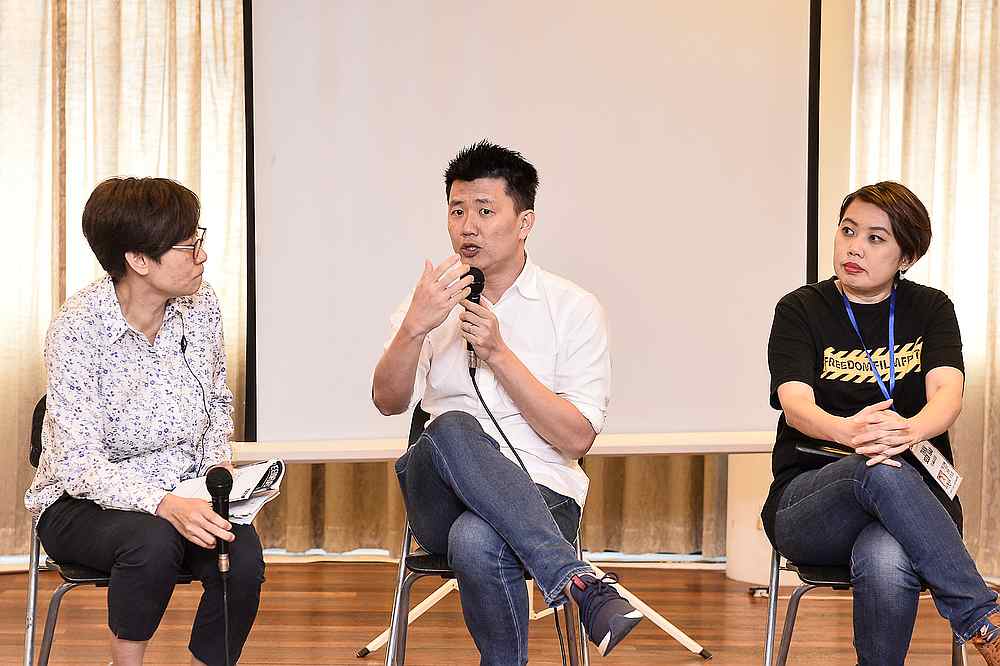 Director of 'The Tree Remembers' Lau Kek Huat (centre) and 'May 13' documentry Tham Seen Hau (right) speaks during a Freedom Film Festival 2019 interview September 27,2019. u00e2u20acu201d Picture by Miera Zulyana