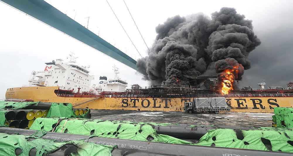 Smoke rises from a fire at a vessel at a port in Ulsan, South Korea, September 28, 2019. u00e2u20acu201d Yonhap pic via Reuters