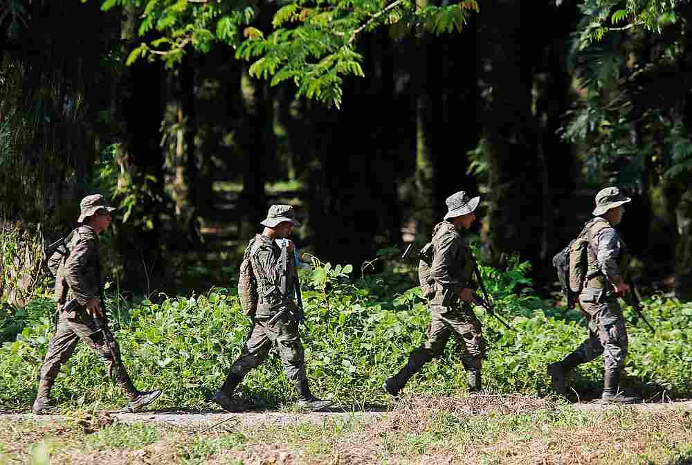 Soldiers patrol during a temporary state of siege, approved by the Guatemalan Congress following the death of several soldiers last week, in Izabal province, Guatemala September 9, 2019. u00e2u20acu201d Reuters pic