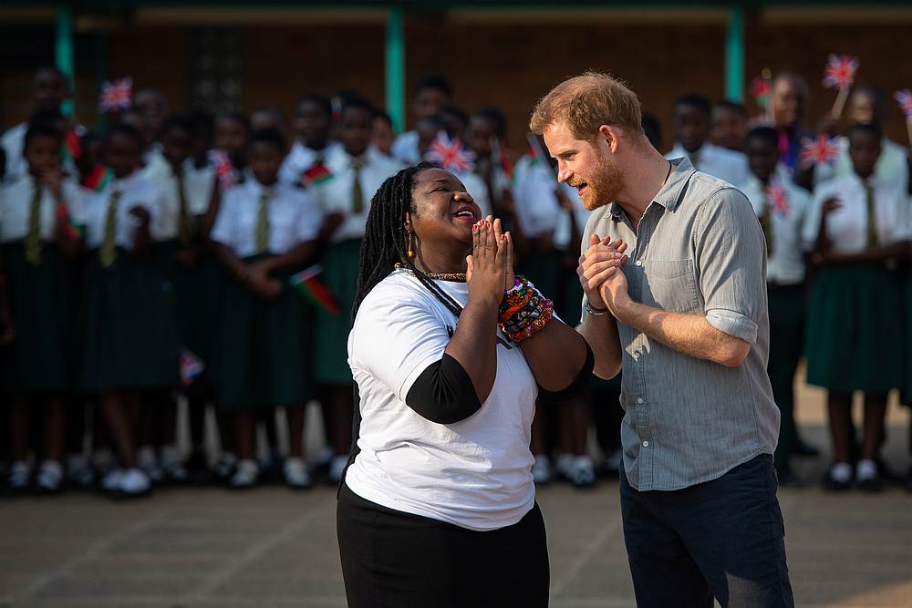 Britain's Prince Harry speaks to Angeline Murimirwa, executive director for Camfed in Africa, during his visit to Nalikule College of Education in Lilongwe, Malawi, September 29, 2019. u00e2u20acu201d Dominic Lipinski/Pool pic via Reuters