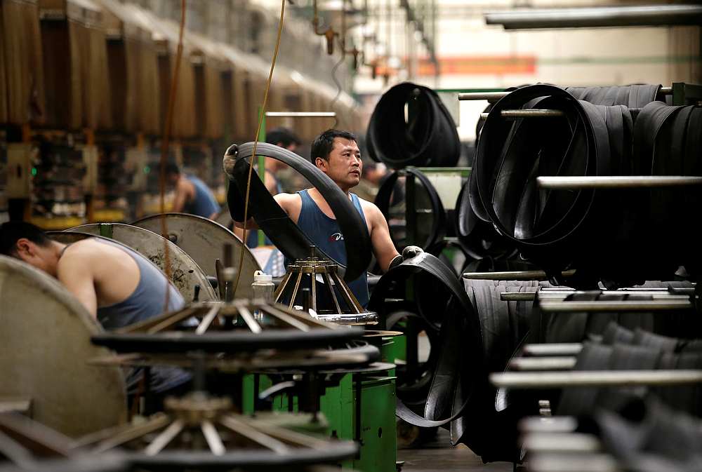 An employee works on the production line of a tyre factory under Tianjin Wanda Tyre Group, which exports its products to countries such as US and Japan, in Xingtai, Hebei province, China May 21, 2019. u00e2u20acu201d Reuters pic