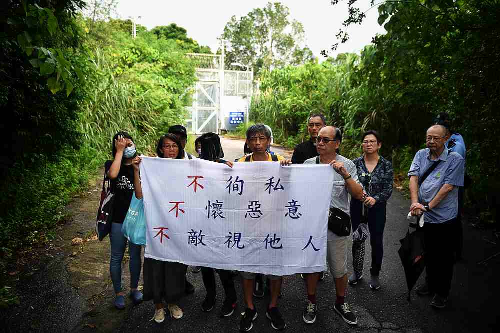 Members of the 'Grey Hair Group,' a Hong Kong collective of protest-supporting retirees and elderly, gather at the front gate of San Uk Ling Holding Centre in Hong Kong August 29, 2019. u00e2u20acu201d AFP pic 